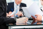 business-meeting-work-contract-office-lawyers-attorneys-discussing-document-agreement-35770643.jpg